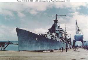 Portside bow view of the USS Minneapolis cruiser at dockin Pearl Harbor; color