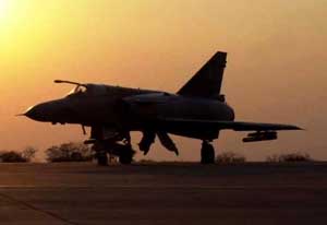 Front left side view of an Atlas Denel Cheetah at sunset