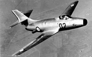 High-angled right side view of the Dassault MD.450 Ouragan jet-powered fighter in flight