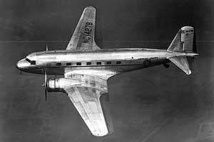 High-angled left side view of a Douglas DC-2 passenger airliner in flight