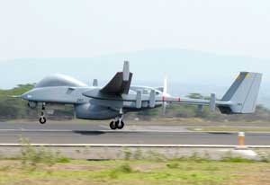 Left side view of an IAI Heron TP Unmanned Aerial Vehicle achieving flight during counter-drug operations in El Salvador