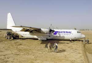 Distance view of the Lockheed L-100 Hercules transport.