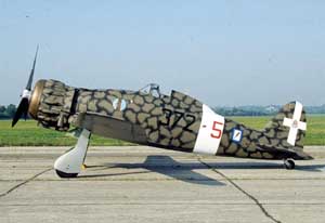 Right profile view of the Macchi C.200 Saetta fighter at rest; color