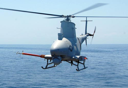 An incoming MQ-8B Sea Scout unmanned autonomous helicopter system of the U.S. Navy