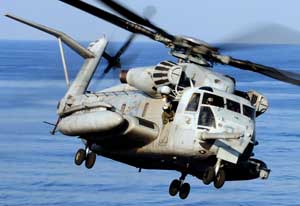 Front right side view of a banking Sikorsky CH-53 Sea Stallion helicopter