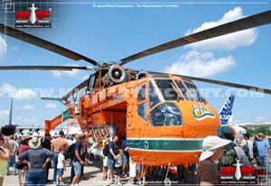 Front right side view of an Erickson Skycrane helicopter on display; color