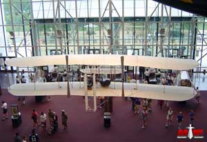 A Wright Flyer hanging in the entrance hall of the Smithsonian; color