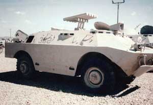 Front right side view of the 9P148 Konkurs Scout Car with Spandrel missile system mount; color