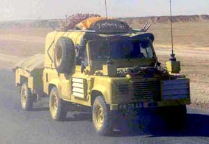 Front right side view of a Land Rover Defender 110 4x4 light vehicle in transit