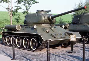 Front right side view of a T-34/85 medium tank on display; color