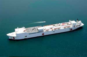 High-angled portside view of the USNS Comfort at sea.