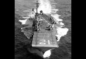 The USS Hornet CV-12 aircarft carrier makes way under full steam