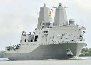 Front right view of the USS New York traversing the Mississippi River in October of 2009