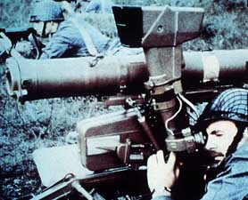 Old propaganda shot of a Soviet soldier readying his AT-4 Spigot anti-tank missile launcher; color