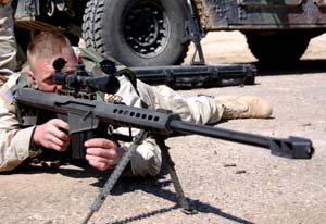 A soldier readying his Barrett M82 anti-materiel rifle
