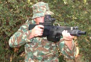 A soldier showcases the proper stance when wielding the Denel PAW-20 Neopup grenade launcher