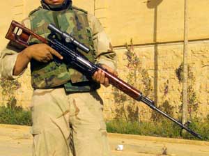 Right side view of the Dragunov SVD sniper rifle in the hands of an Iraqi soldier.