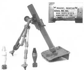 Front left side view of the Mortar, 60mm M2 system with bipod and baseplate in place; note baseplate detail and mortar projectile design